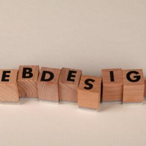 Wooden blocks spelling 'web design' creatively showcase digital design concept.